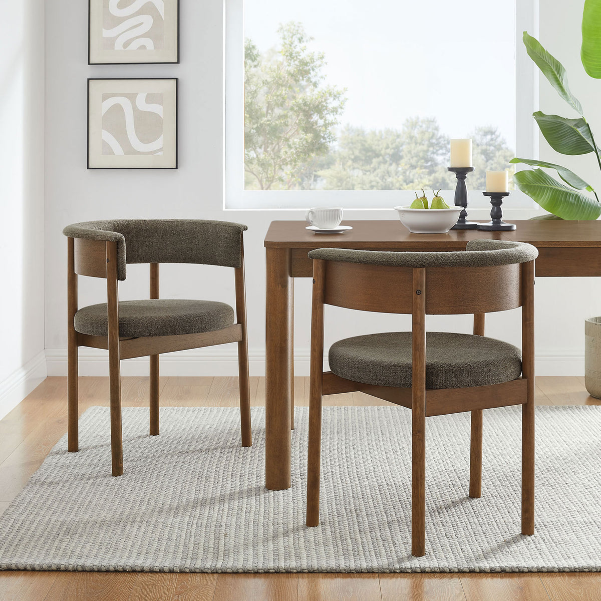 Set of two taupe curved dining chairs around a wood table in a modern airy dining room || EEI-7467-TAU || front_angle_multi_room