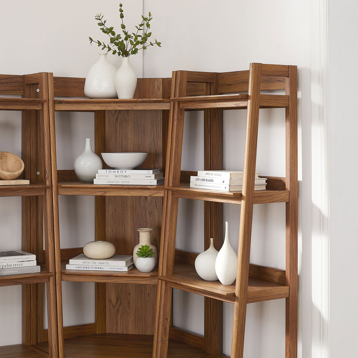 Styled shelves showcase decor and books, bringing warm texture to a light, modern corner || EEI-7470-WAL || detail_room