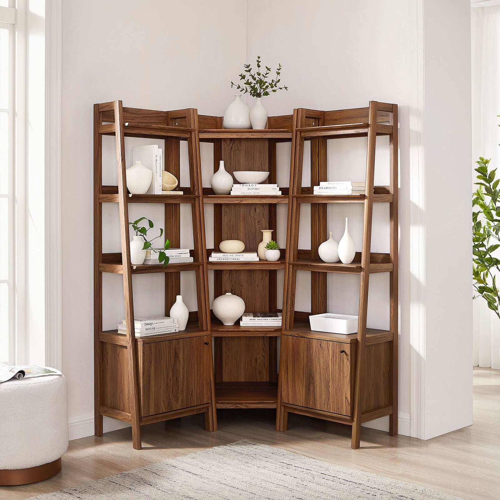 Space-saving corner bookshelf set anchors the room with generous display and closed storage || EEI-7470-WAL || front_angle_room