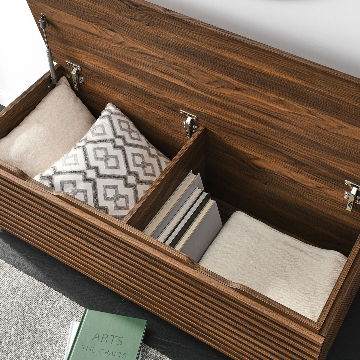 Flip-top bench opens to deep, divided storage with soft-close hinges for pillows, books, and shoes || EEI-7473-WAL || storage_open_room