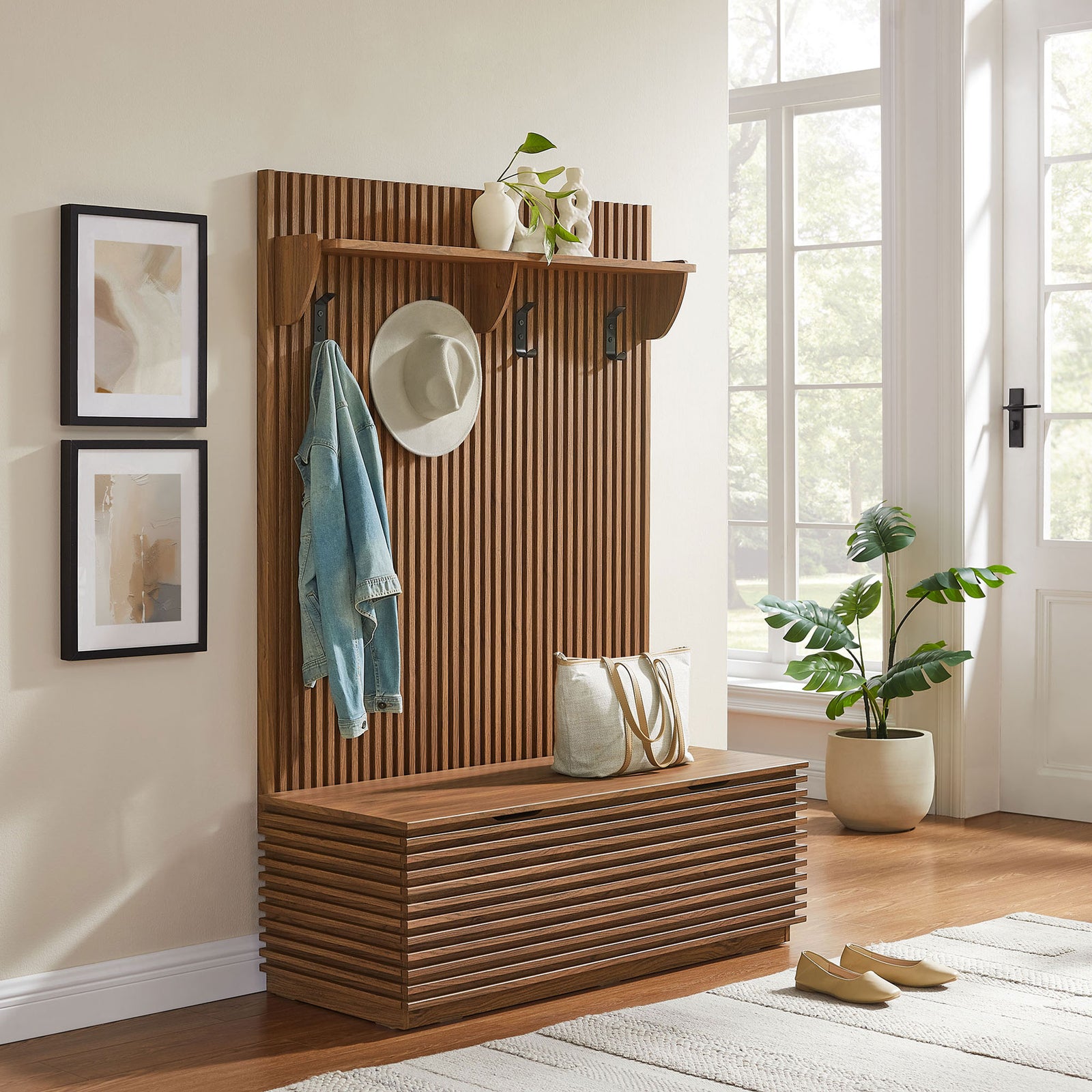 Streamlined hall tree elevates the entry with warm walnut tones and practical hooks, shelf, and bench storage || EEI-7473-WAL || front_angle_room