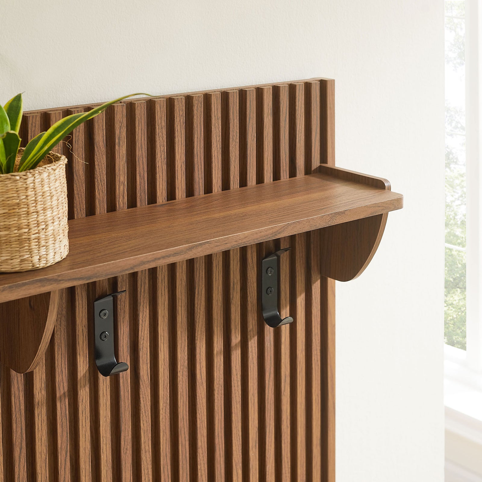 Slatted panel detail with wood shelf and matte black coat hooks || EEI-7474-WAL || detail_room