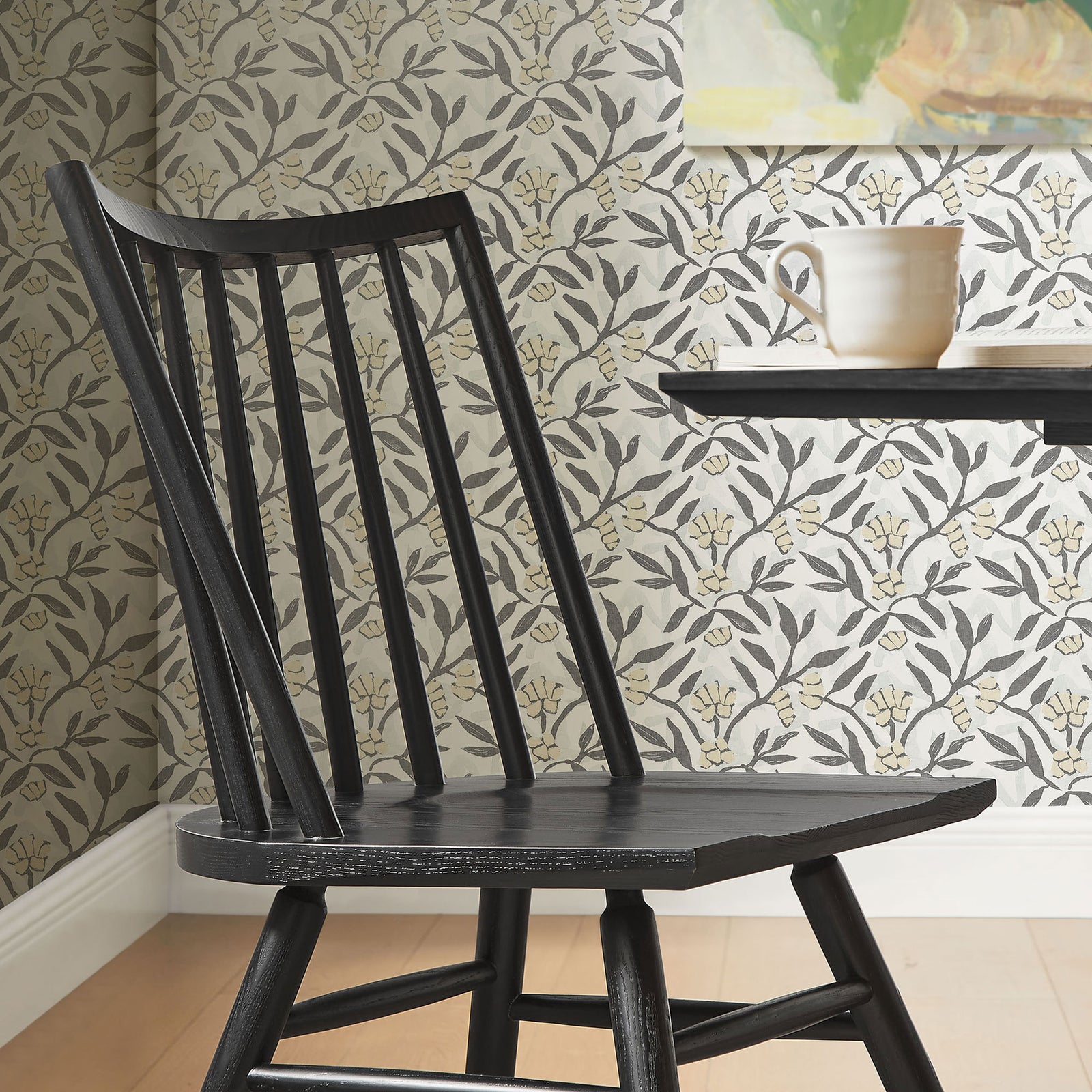 Black spindle back dining chair styled beside a round dining table in a patterned, modern dining room. || EEI-7482-BLK || detail_room