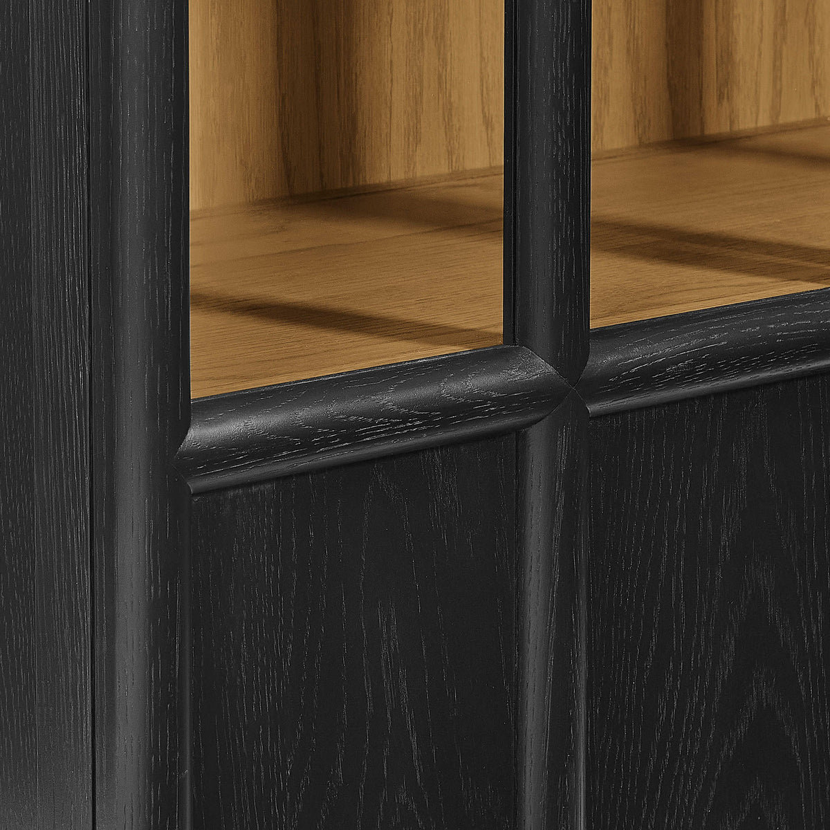 Black oak frame with rounded mullions and visible grain for a refined, crafted cabinet look || EEI-7484-BLK-OAK || detail_studio
