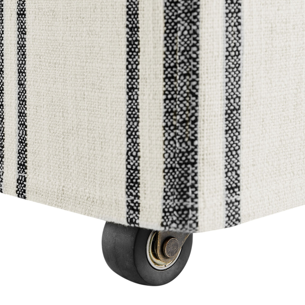 Hidden rolling caster tucked beneath the striped slipcovered base for smooth, easy movement. || EEI-7486-BLK || leg_studio