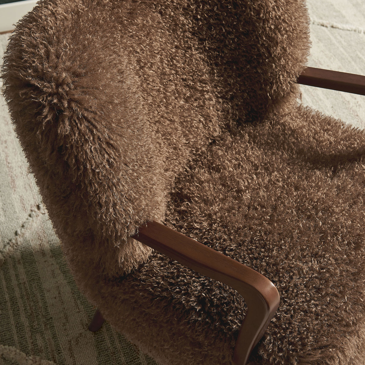 Curly faux shearling and contoured wood arms bring cozy texture to modern interiors. || EEI-7487-BRN || detail_room