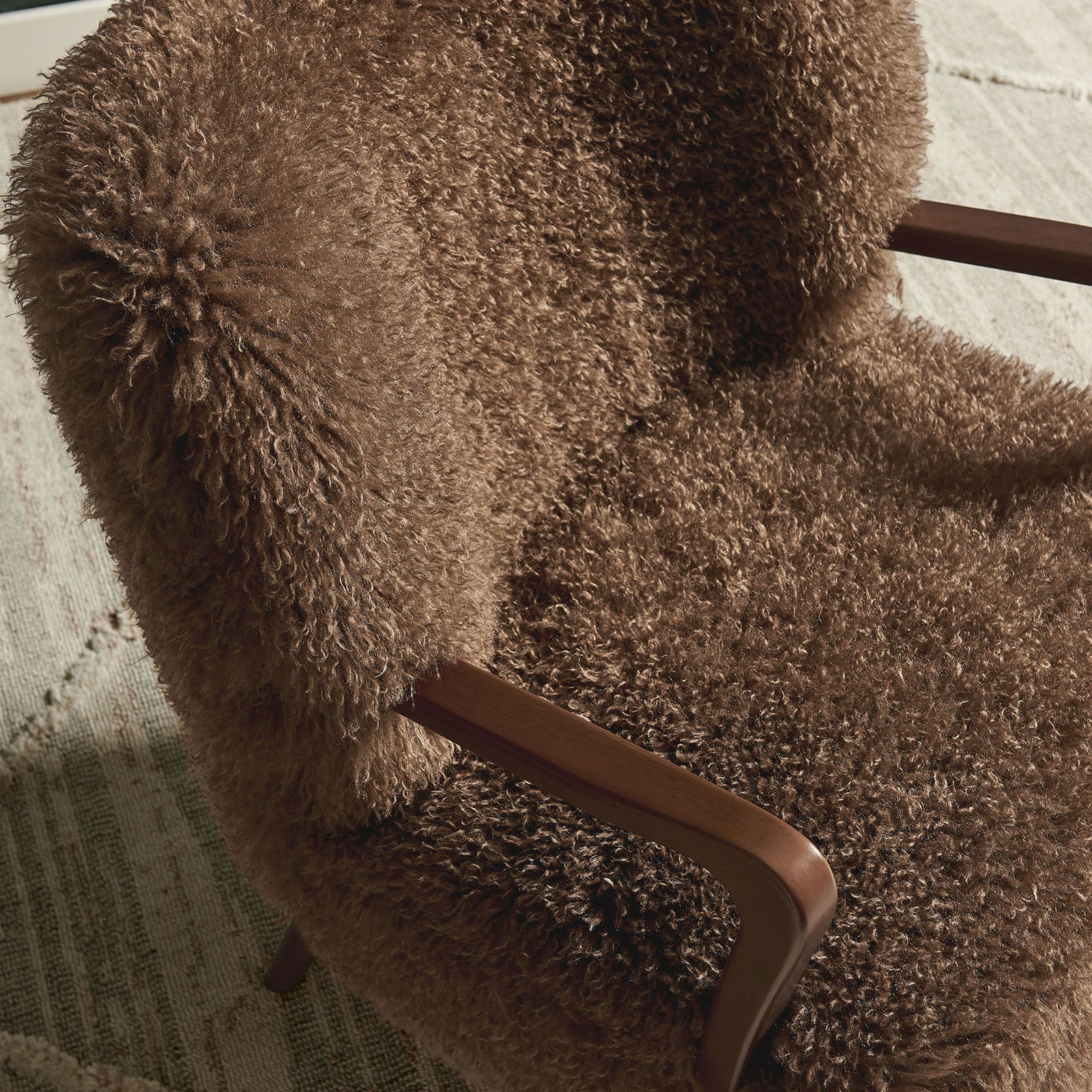 Curly faux shearling and contoured wood arms bring cozy texture to modern interiors. || EEI-7487-BRN || detail_room