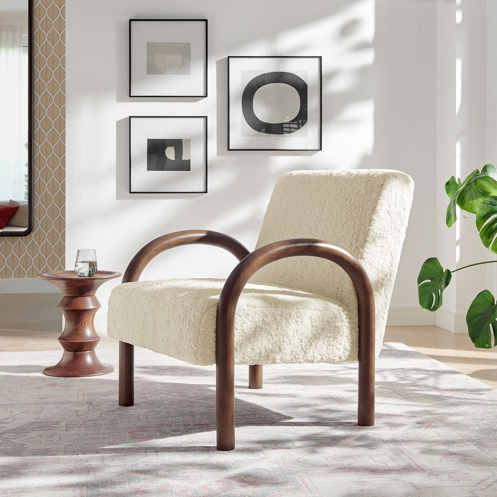 Modern accent chair warms the room with plush faux shearling and artful curved wood arms || EEI-7488-ECR || front_angle_room