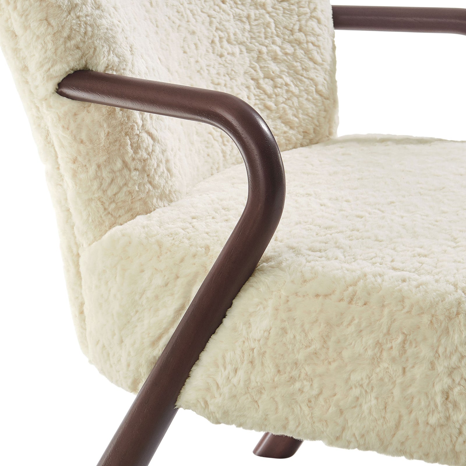 Rich contrast between smooth walnut-tone wood arms and plush faux shearling upholstery. || EEI-7489-ECR || detail_studio