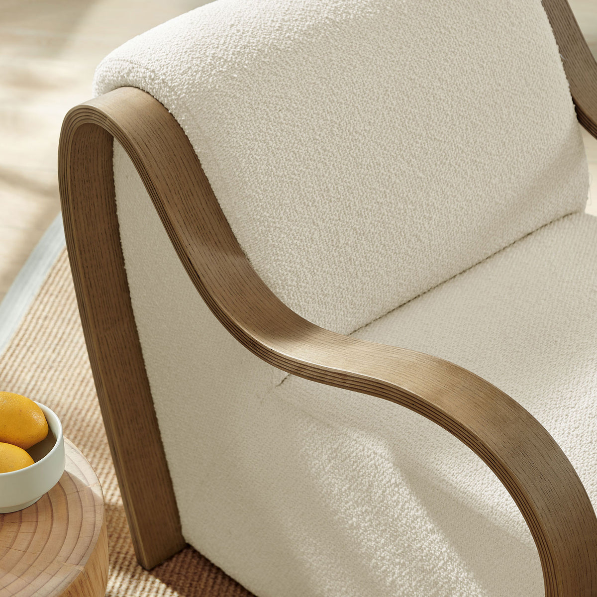 Boucle texture and contoured wood arm bring inviting warmth to the space || EEI-7490-CRE || detail_room