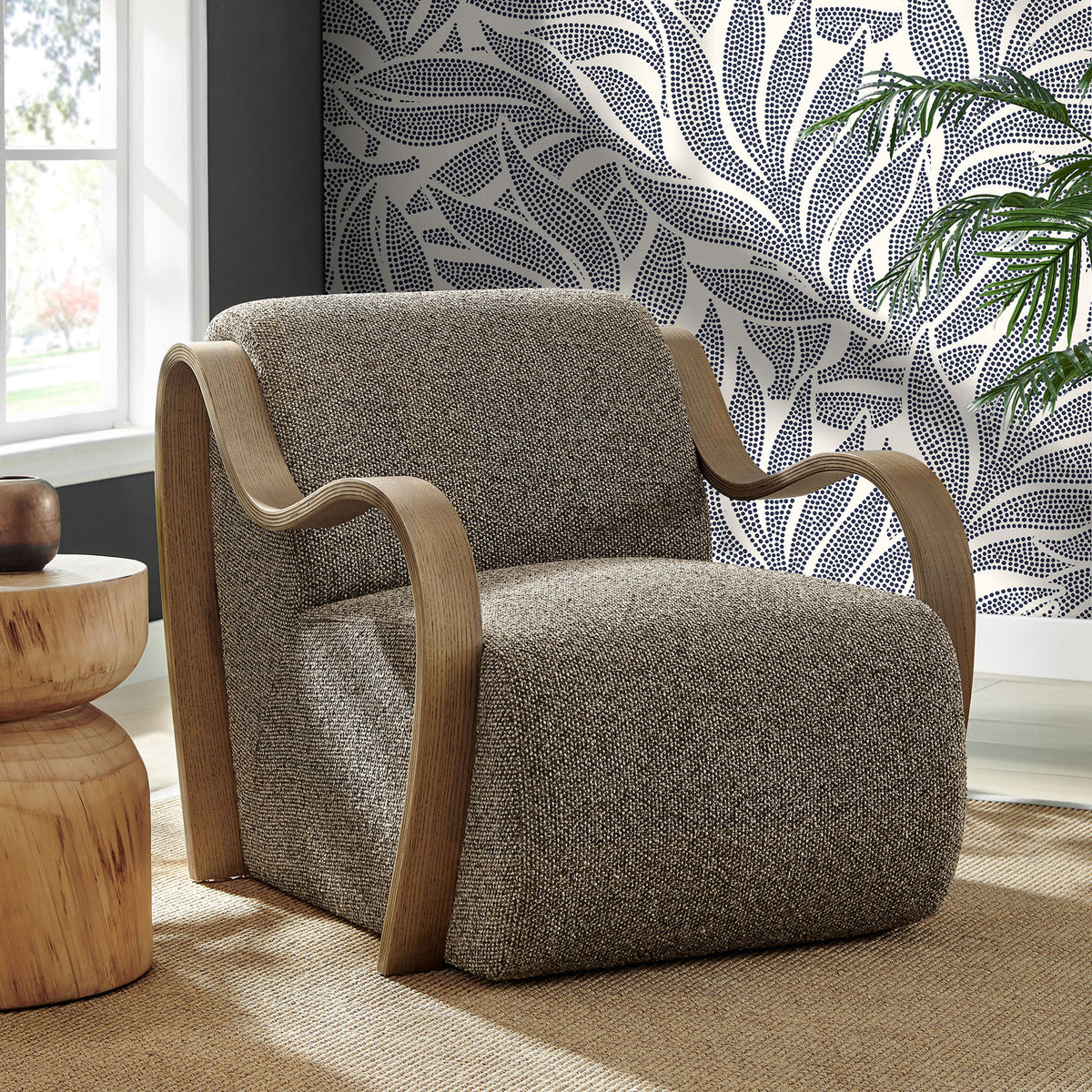 Statement lounge chair pairs curved wood arms with richly textured boucle for modern warmth. || EEI-7490-ETH || front_angle_room