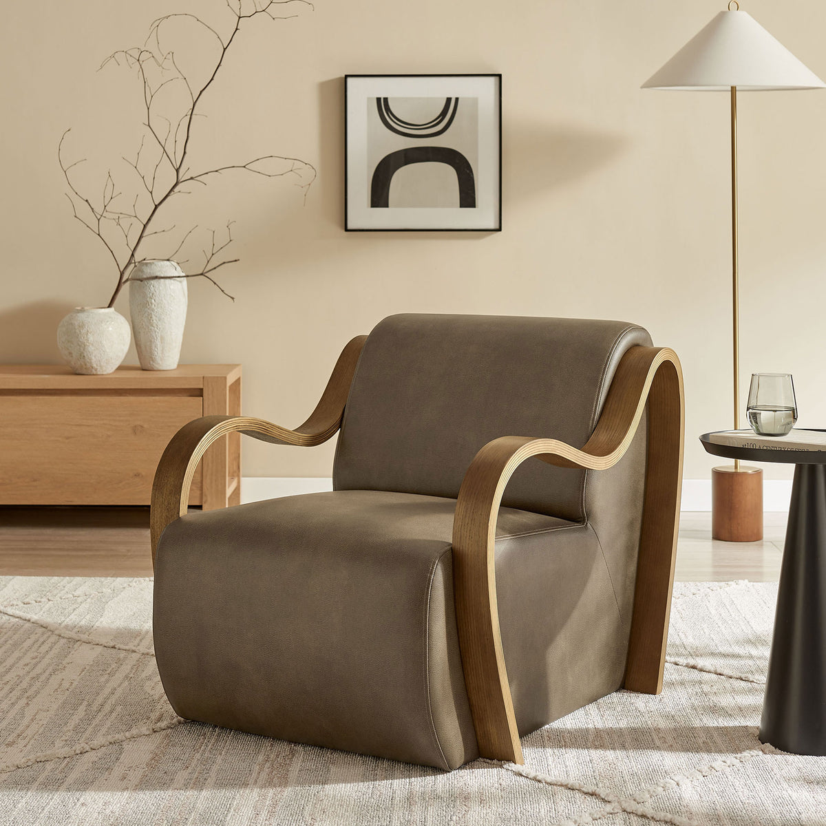 Modern armchair in mushroom vegan leather with bentwood arms, styled for a warm, minimalist living space. || EEI-7491-MUS || front_angle_room