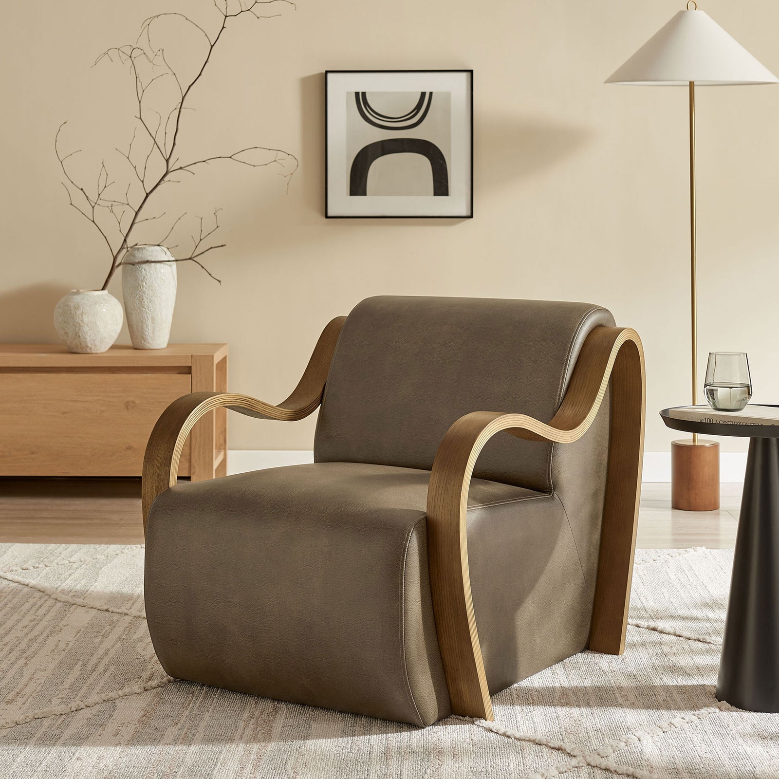 Modern armchair in mushroom vegan leather with bentwood arms, styled for a warm, minimalist living space. || EEI-7491-MUS || front_angle_room