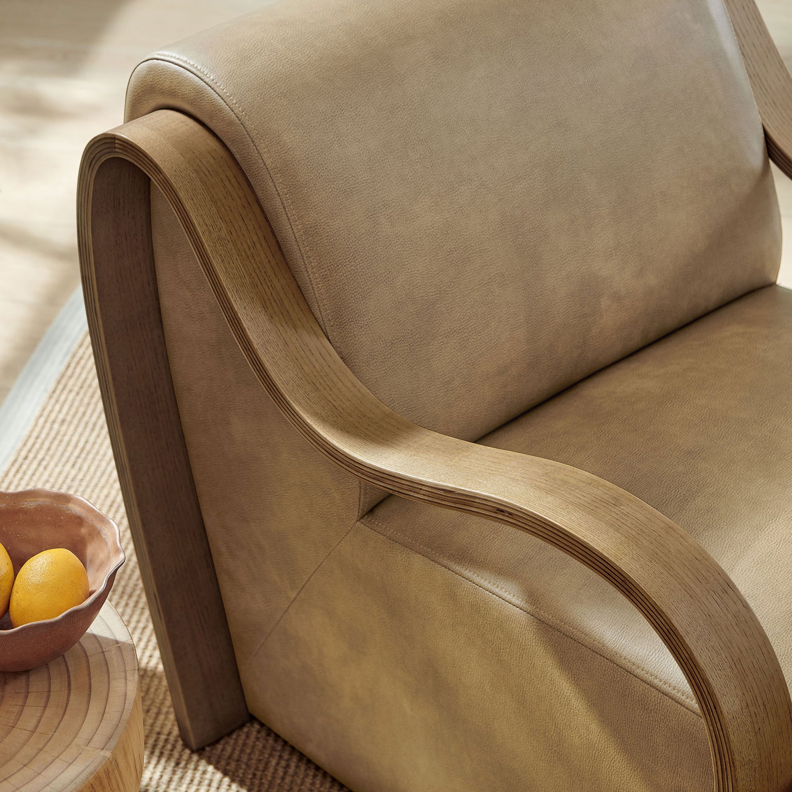 Textured vegan leather and curved wood arm bring warmth and organic character to the seat || EEI-7491-TST || detail_room