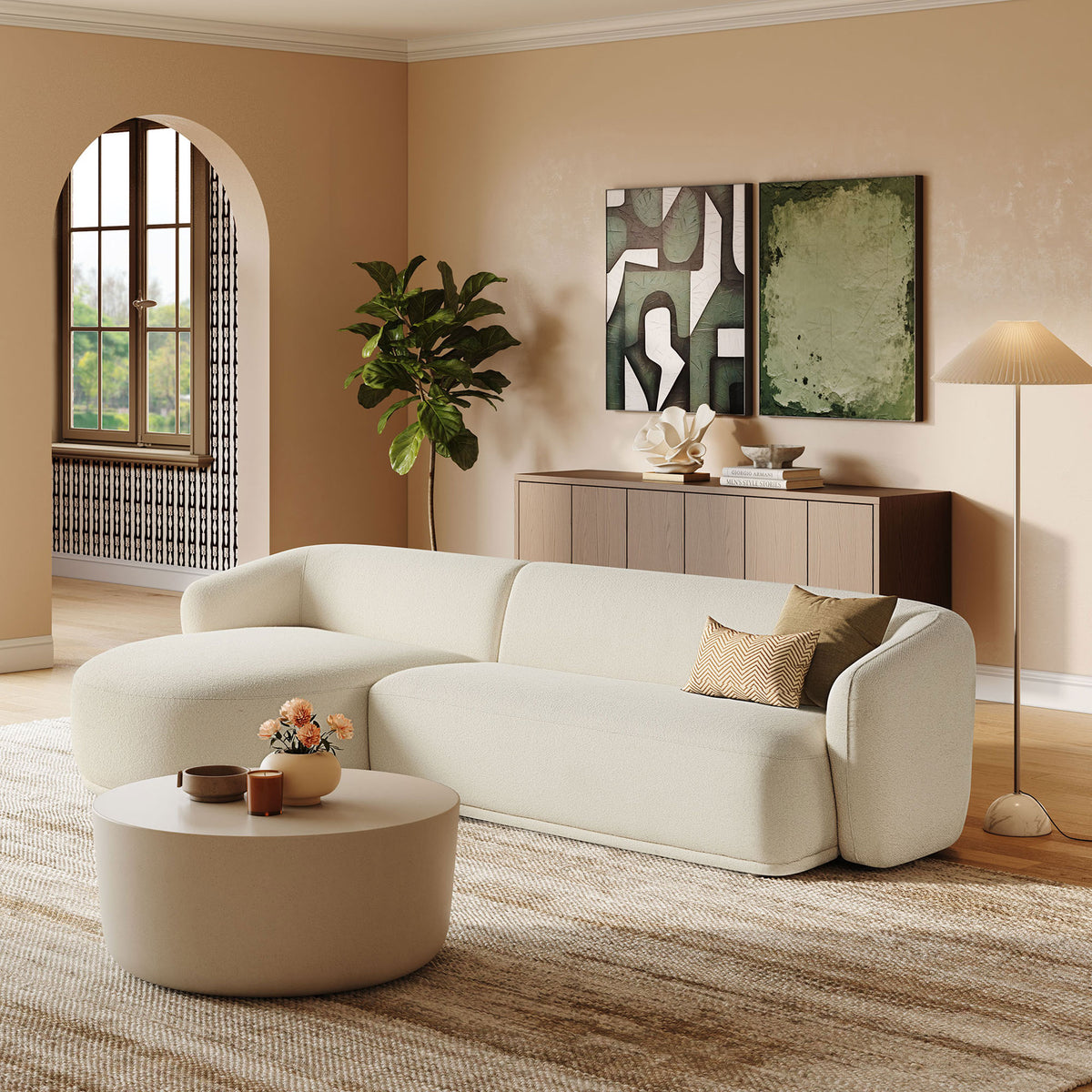 Left facing Monica sectional styled with neutral decor, round coffee table, and textured area rug. || EEI-7502-CRE || front_angle_room