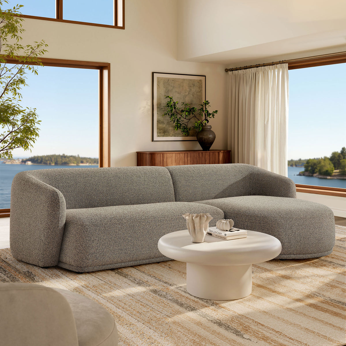 Right-facing Monica sectional anchors a bright living room with boucle texture and inviting modern comfort || EEI-7503-ETH || front_angle_room