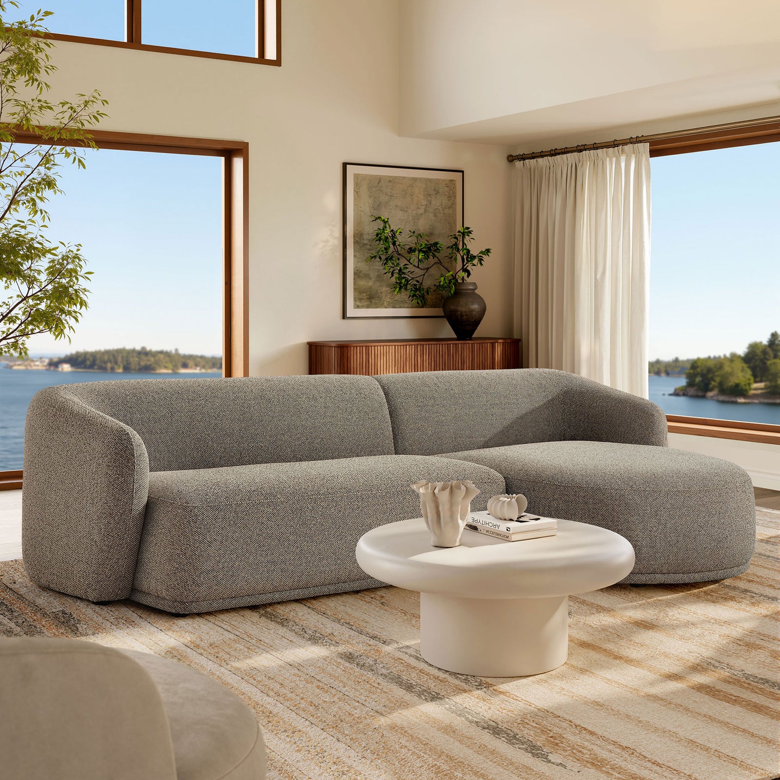 Right-facing Monica sectional anchors a bright living room with boucle texture and inviting modern comfort || EEI-7503-ETH || front_angle_room