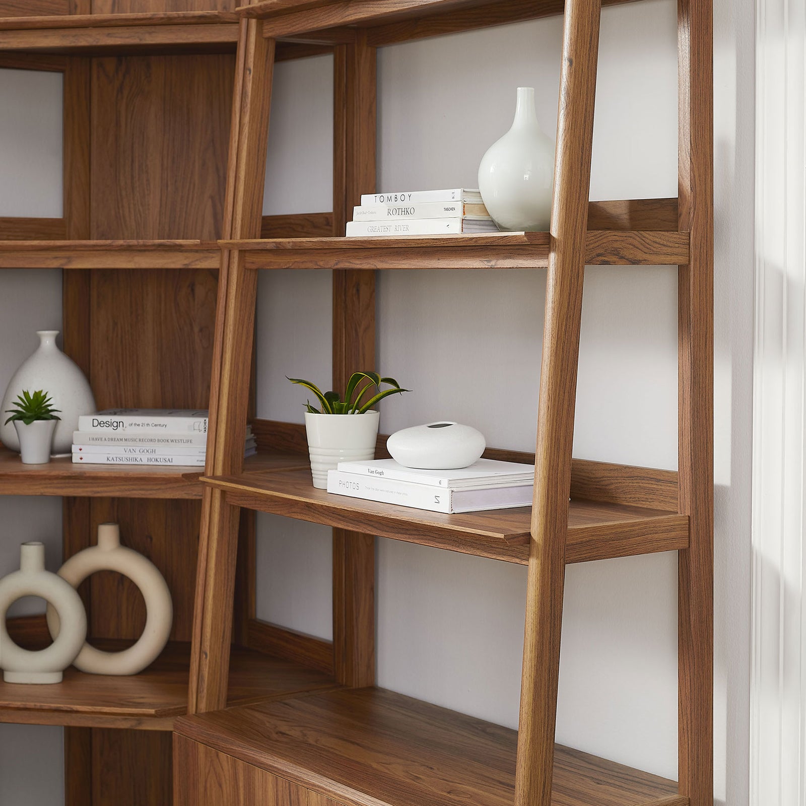 Styled shelves highlight the warm walnut finish and airy open design with clean lines || EEI-7511-WAL || detail_room