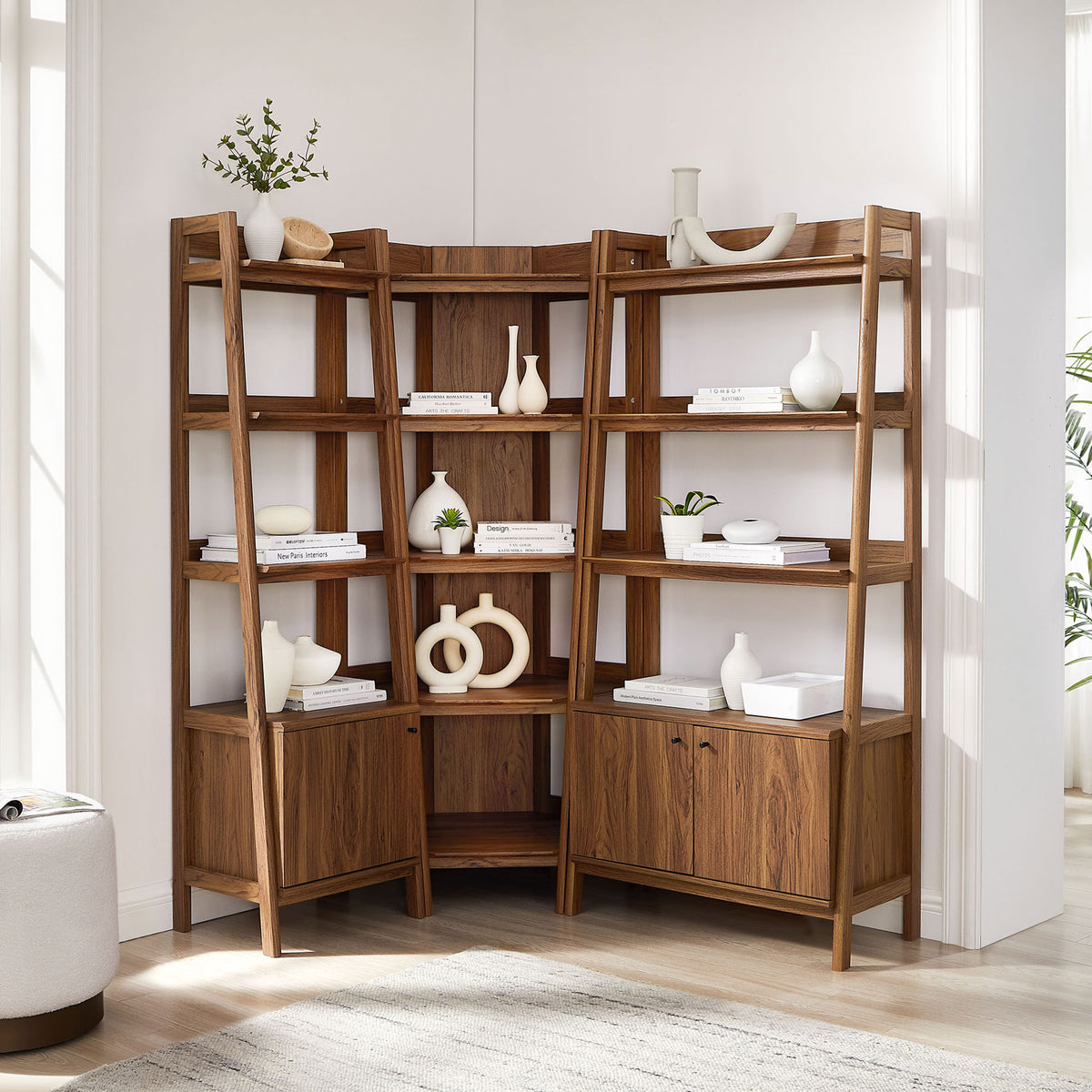 Corner bookshelf set styled for living rooms, blending open display with concealed cabinet storage || EEI-7511-WAL || front_angle_room