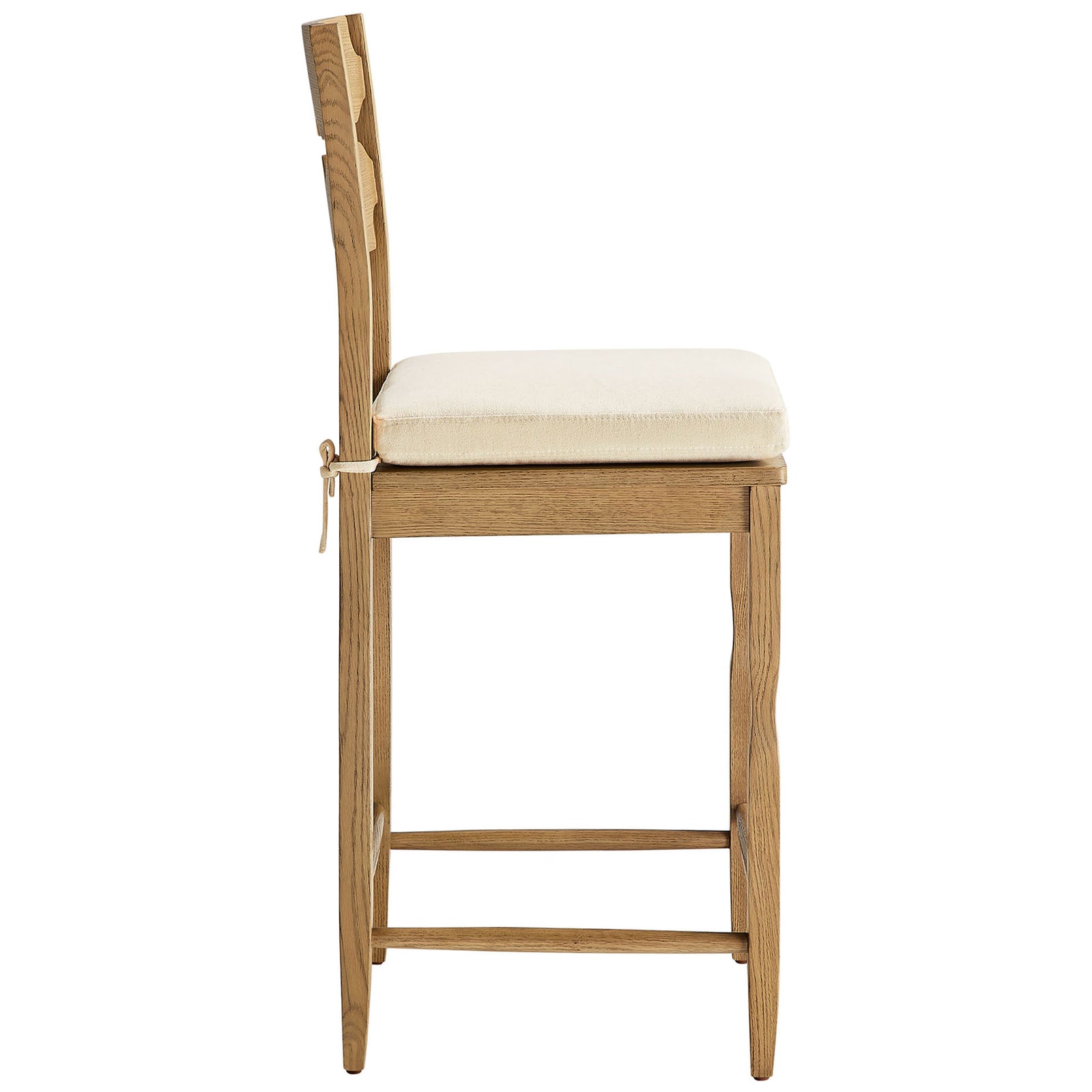 Counter stool highlights tie-on cushion, footrest stretcher, and softly curved oak legs || EEI-7518-WOA-LIN || side_studio