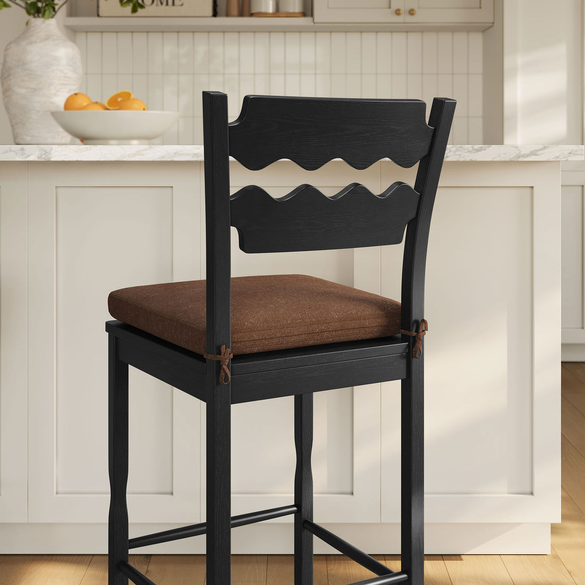 Sculpted backrest and tactile fabric cushion elevate everyday bar seating || EEI-7519-BLK-COA || detail_room