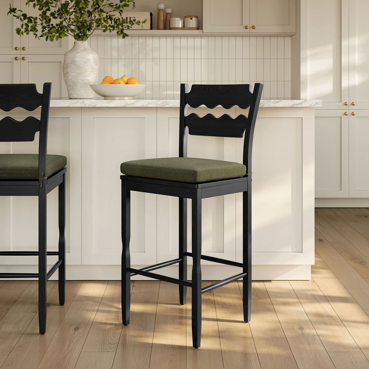 Bar stools elevate a bright kitchen with black oak frames and sage upholstered seats || EEI-7519-BLK-SGE || front_angle_room