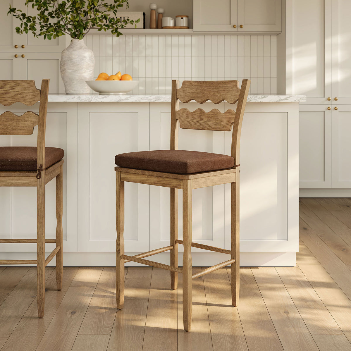 Inviting bar stools add warmth to the kitchen with organic oak texture and cocoa seats || EEI-7519-WOA-COA || front_angle_room