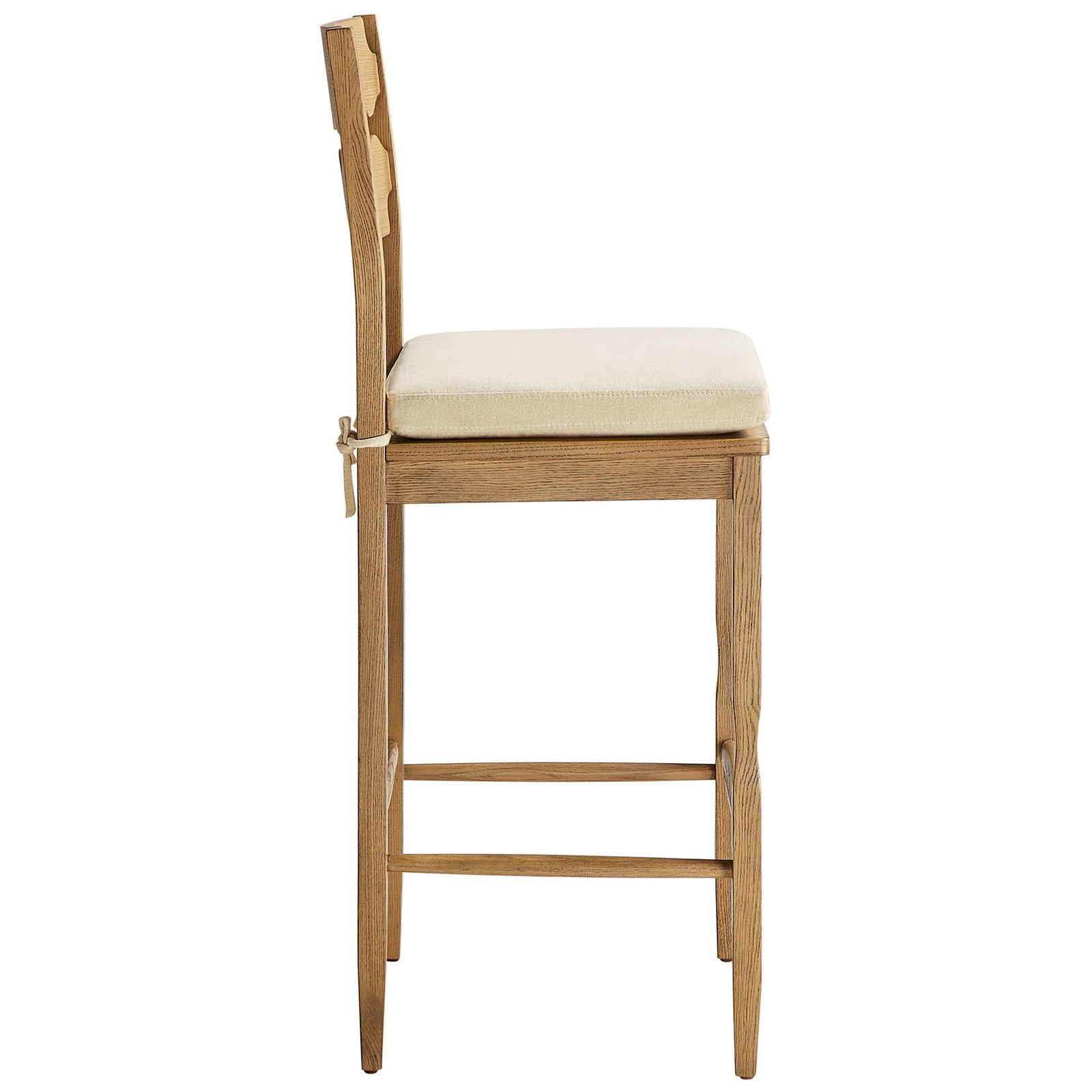Tie-on seat cushion, footrest stretcher, and gently curved legs in solid oak || EEI-7519-WOA-LIN || side_studio