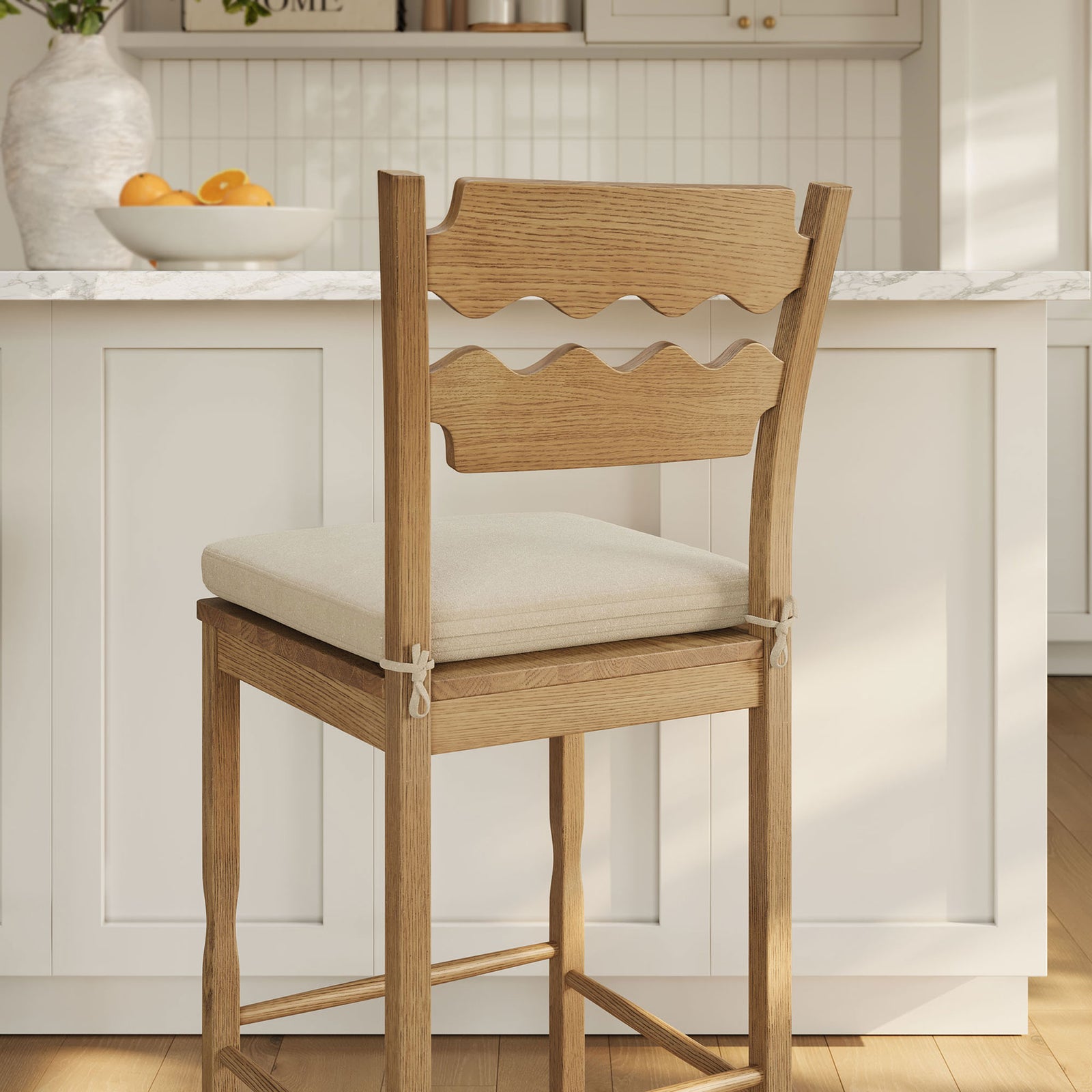 Cafe-inspired wavy back and tidy cushion ties elevate the bright kitchen space || EEI-7519-WOA-LIN || back_angle_room