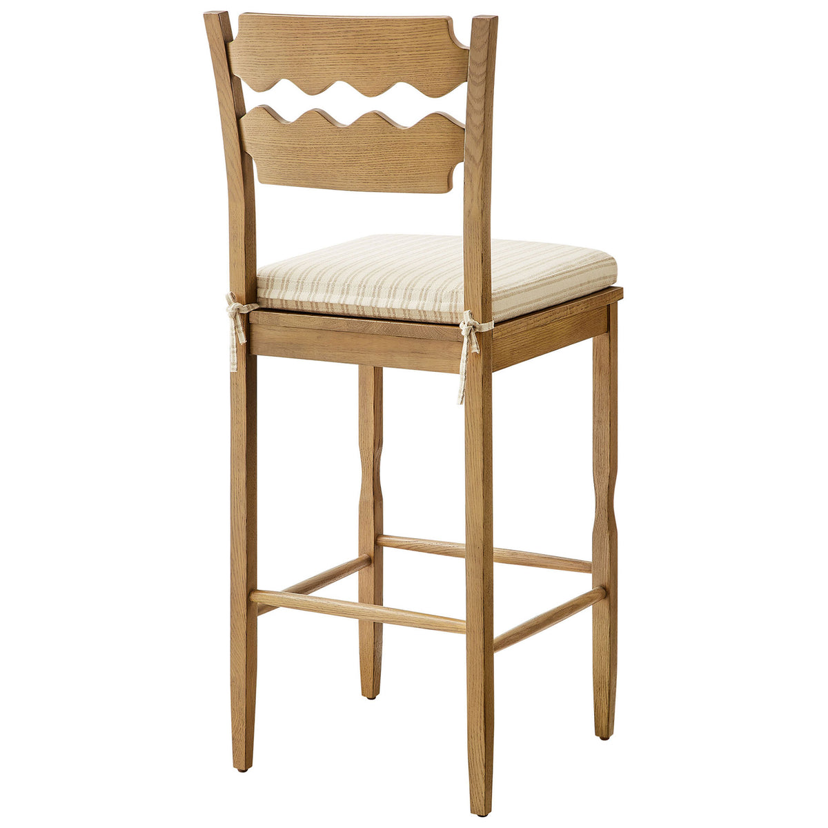 Wavy back slats and tapered legs lend artisanal character to this bar stool. || EEI-7519-WOA-OAS || back_angle_studio