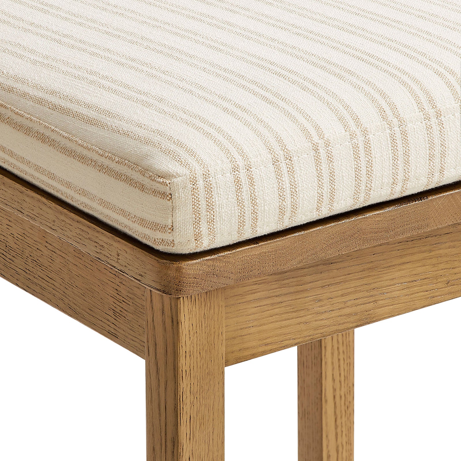 Oatmeal stripe upholstery with crisp piping sits over a smooth, durable oak frame. || EEI-7519-WOA-OAS || detail_studio