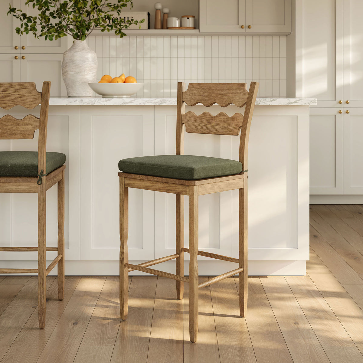 Light, airy kitchen look with oak stool and sage cushion at the island || EEI-7519-WOA-SGE || front_angle_room