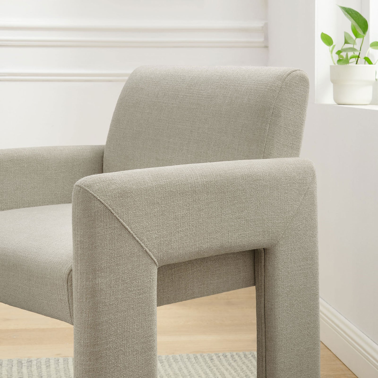Daven linen dining chair styled in a bright room, showcasing softly padded arms and back for inviting comfort || EEI-7524-LIN || detail_room