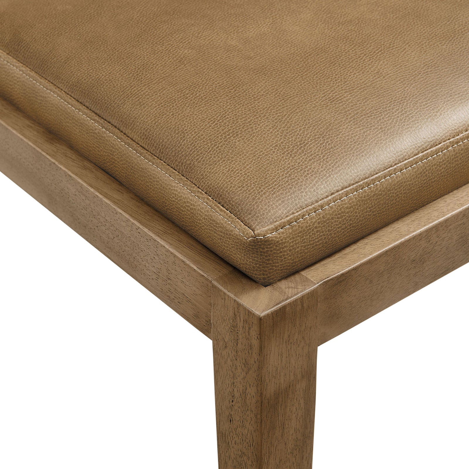 Detail of the Calder chair's toast vegan leather seat, highlighting its neat stitching and tailored edge || EEI-7527-TST || detail_studio
