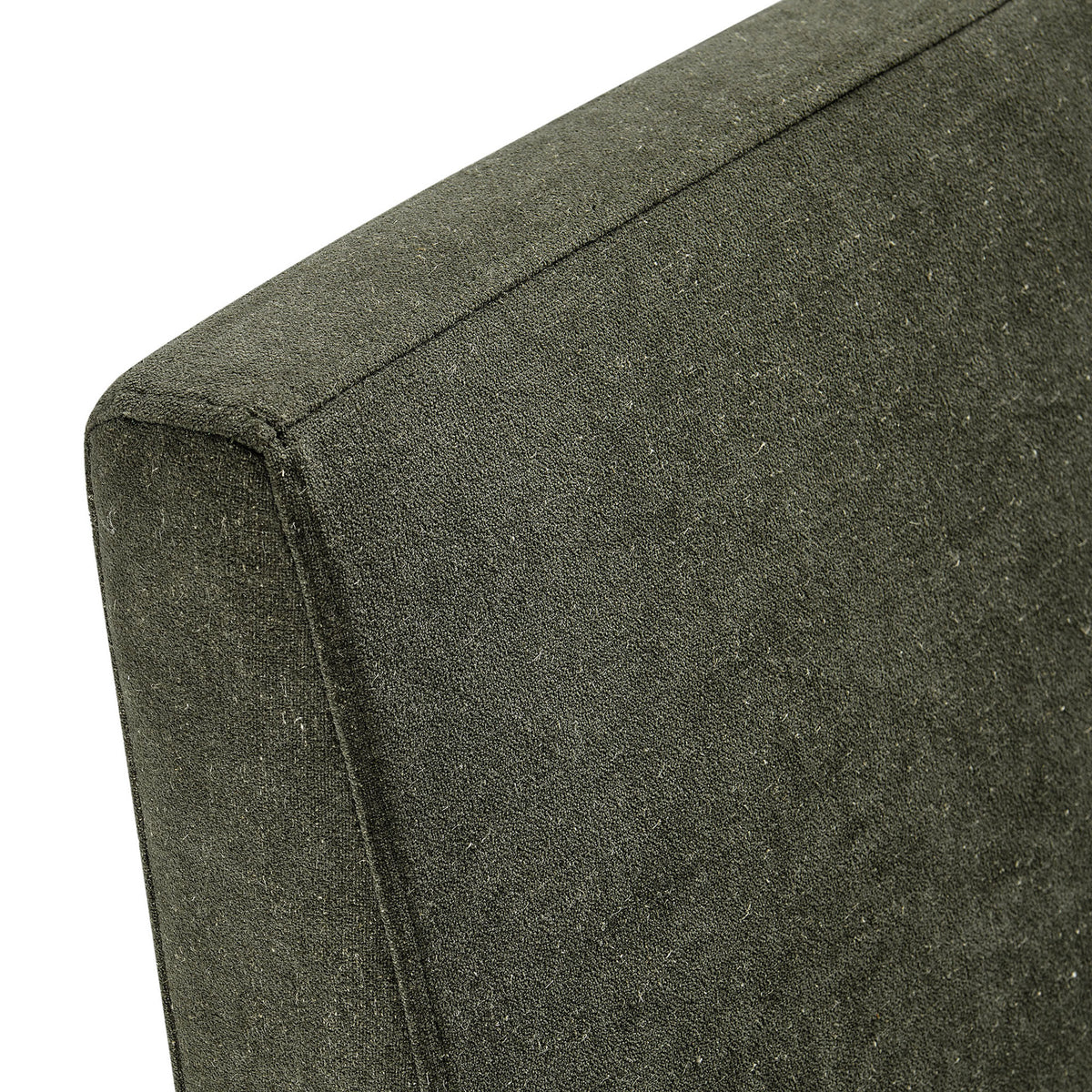 Close-up of textured linen-blend fabric and neatly tailored seams on the sage slipcover || EEI-7528-SGE || detail_studio