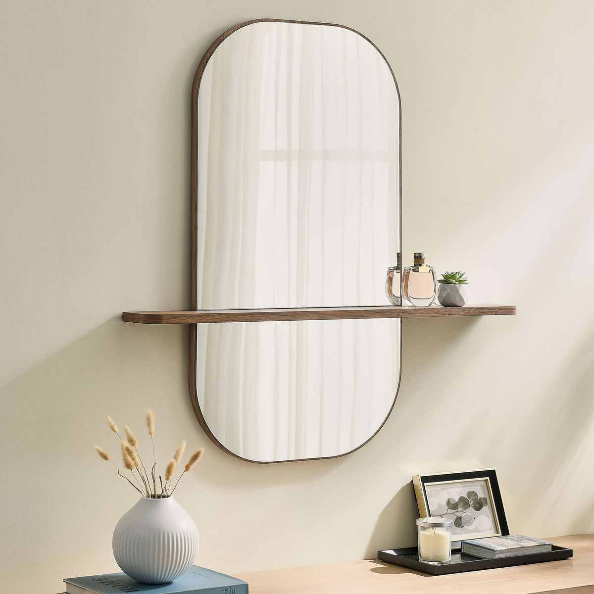 Large walnut wall mirror with shelf styled above decor for a calm, contemporary room. || EEI-7533-WAL || front_angle_room