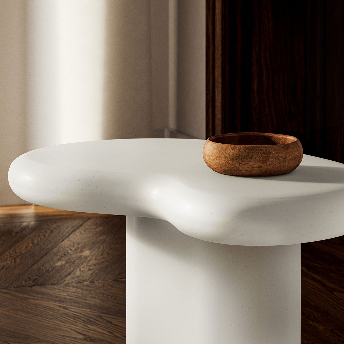 White concrete tabletop in a moody interior, paired with a wooden bowl for a soft modern contrast || EEI-7535-WHI || detail_room