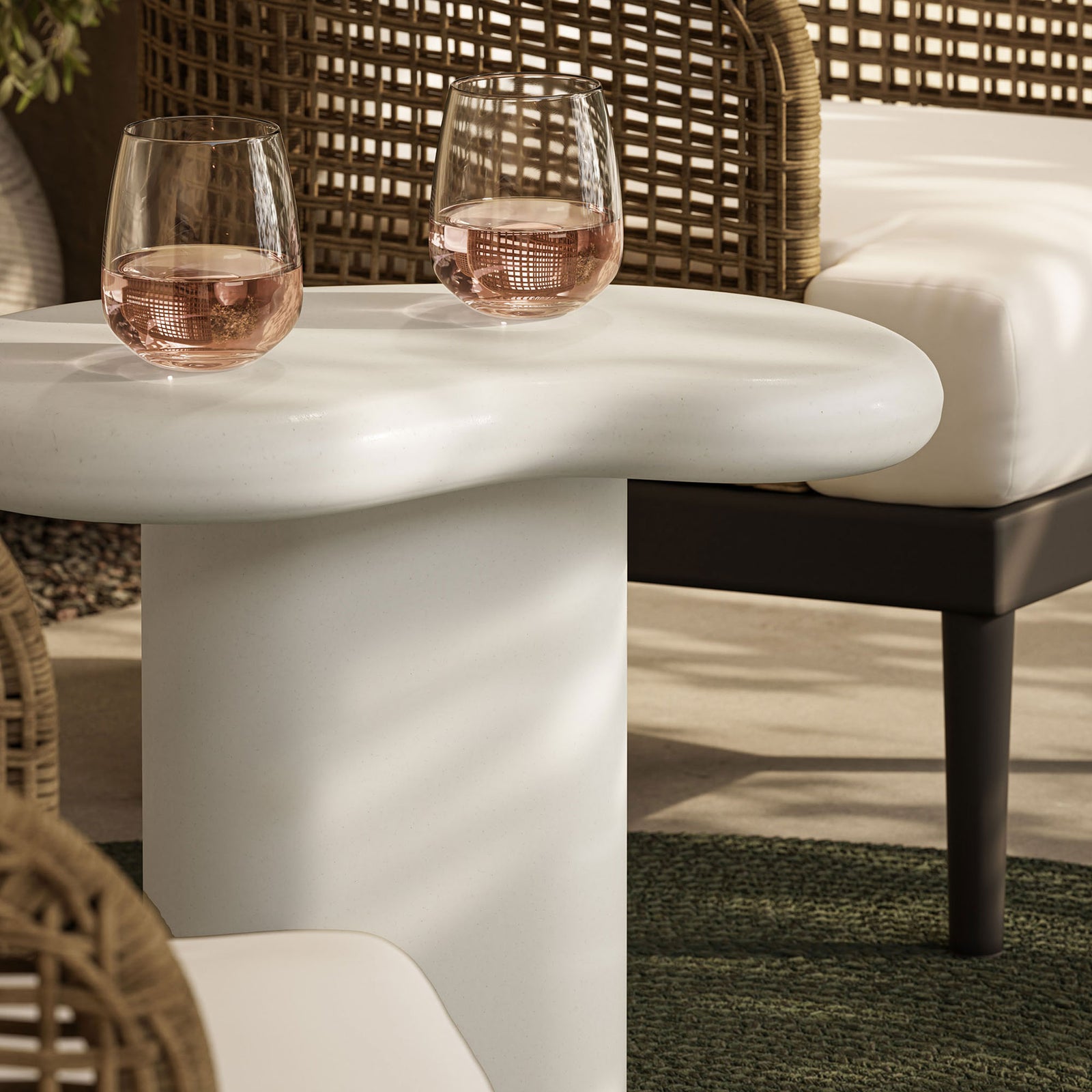 White concrete tabletop styled outdoors with pink drinks, adding a crisp modern touch to the patio lounge || EEI-7535-WHI || detail_room