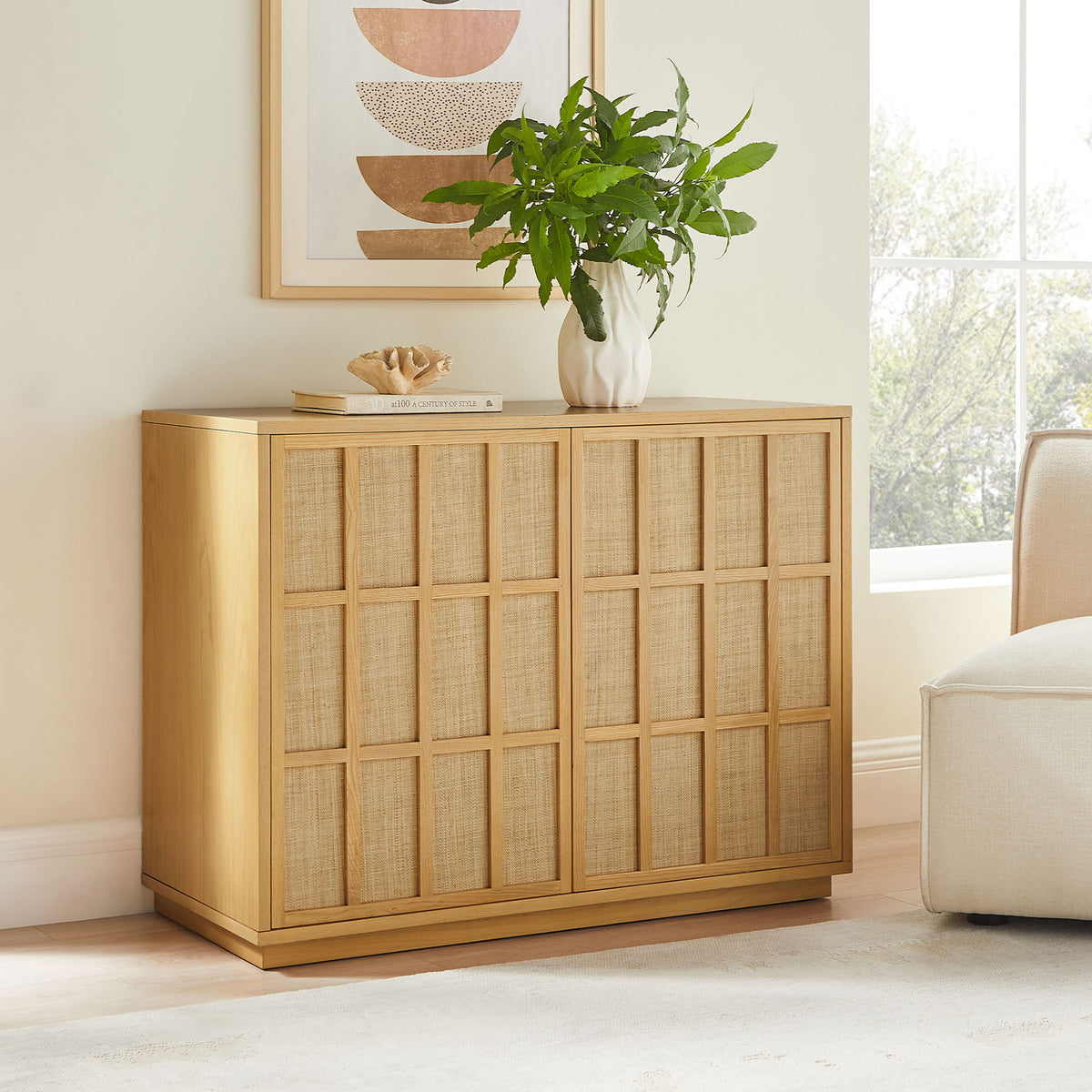 Japandi accent cabinet styled in a serene living room with art, greenery, and soft neutral tones || EEI-7558-LOA || front_angle_room