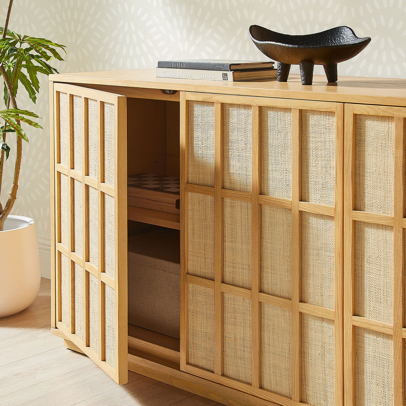Aiko sideboard styled in a bright room with a door open to reveal spacious interior storage shelves || EEI-7559-LOA || front_angle_open_room