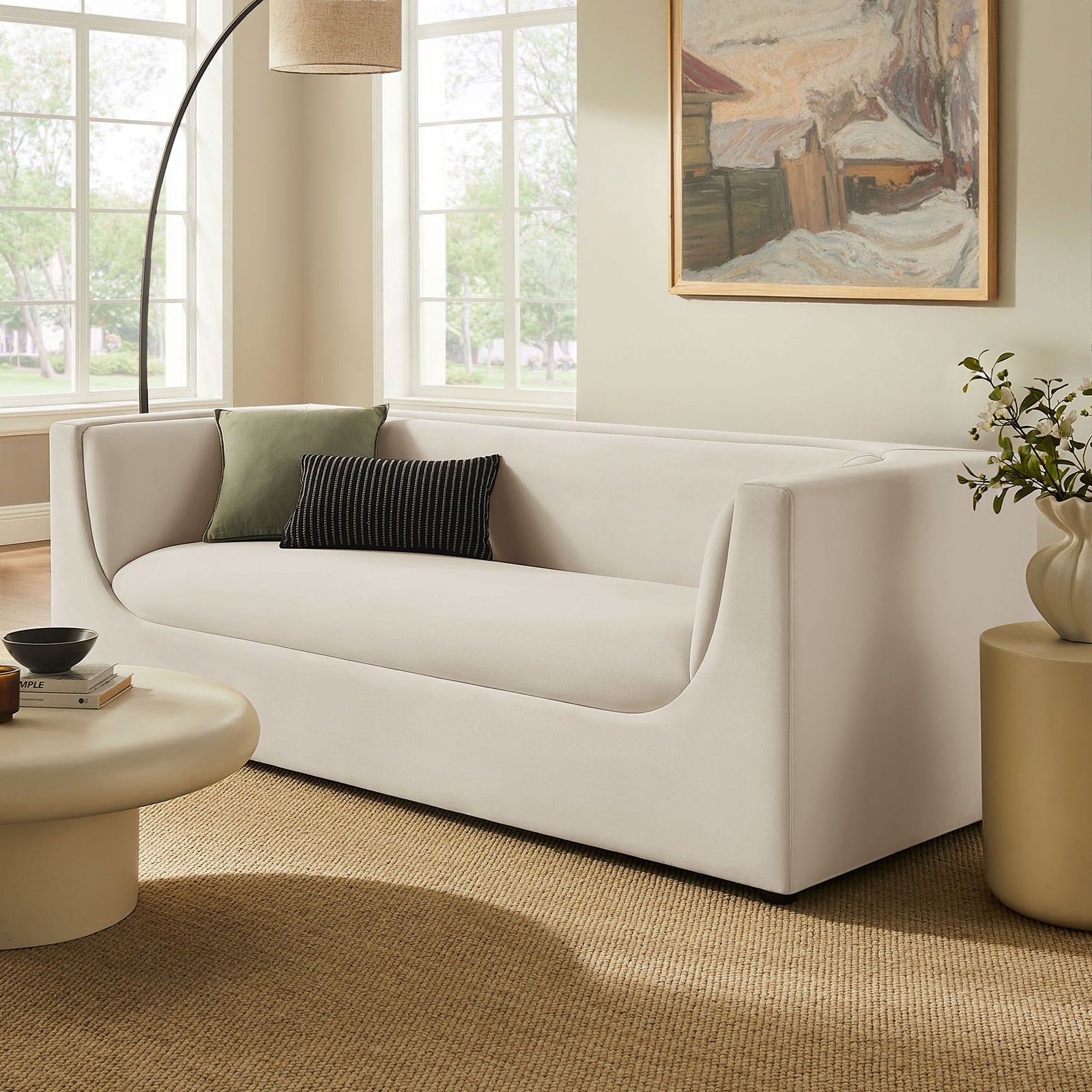 Alabaster performance velvet sofa anchors a modern living room with soft curves and inviting seating. || EEI-7564-ALA || front_angle_room