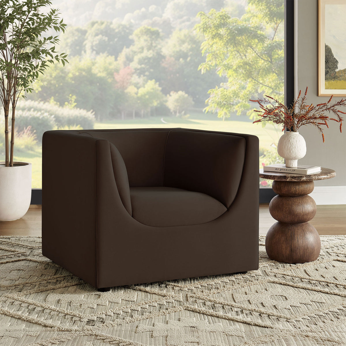Statement armchair adds sculptural comfort to the living room in rich chocolate velvet || EEI-7566-CHB || front_angle_room