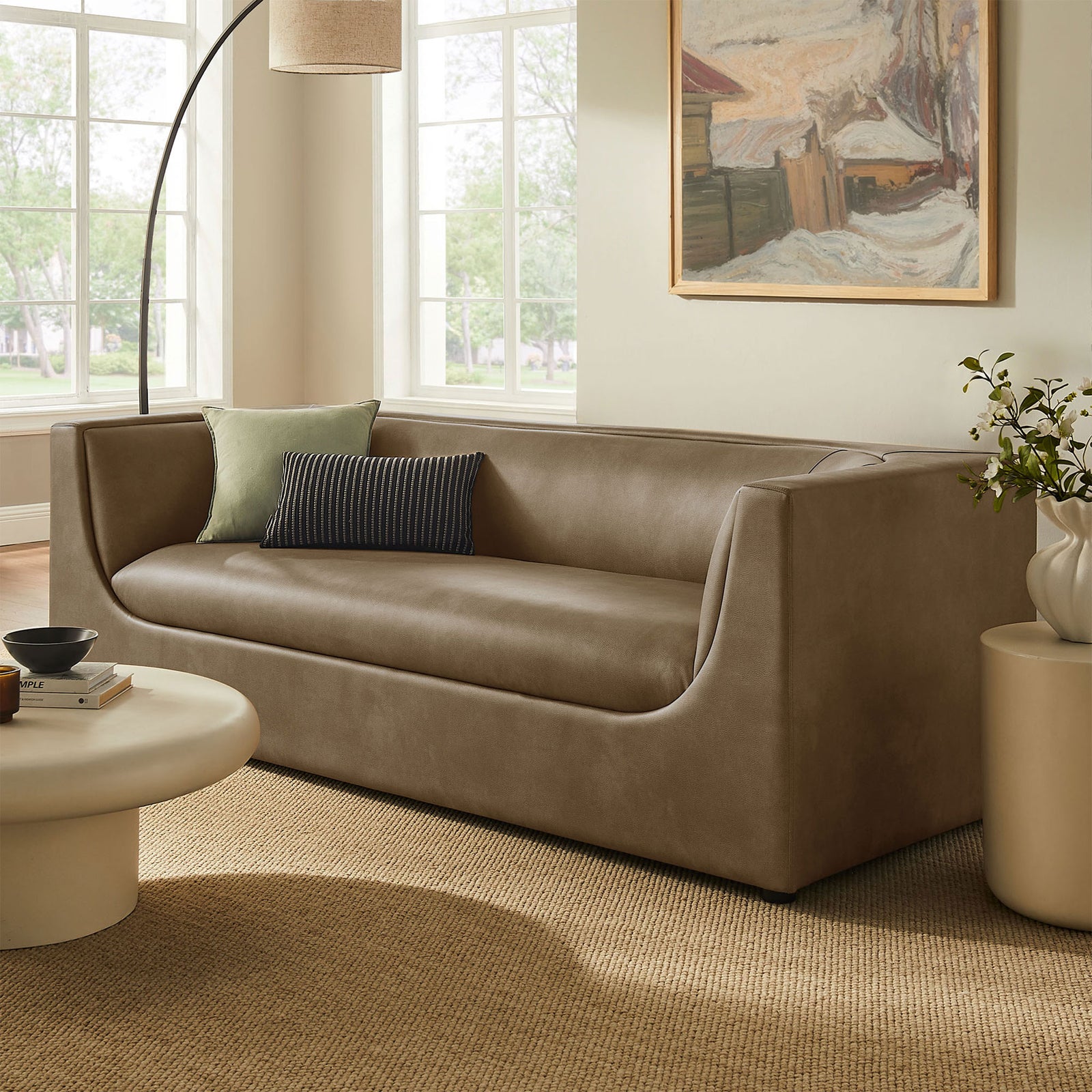 Mushroom vegan leather sofa anchoring a modern living room with round coffee table and floor lamp || EEI-7567-MUS || front_angle_room