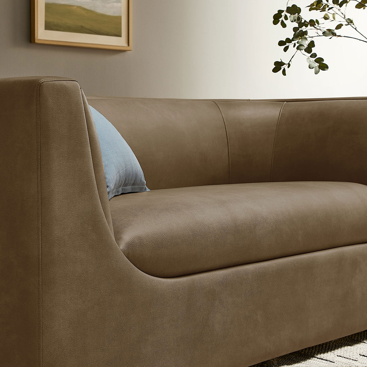Curved back and plush seat cushion create an inviting lounge spot on this mushroom loveseat || EEI-7568-MUS || detail_room