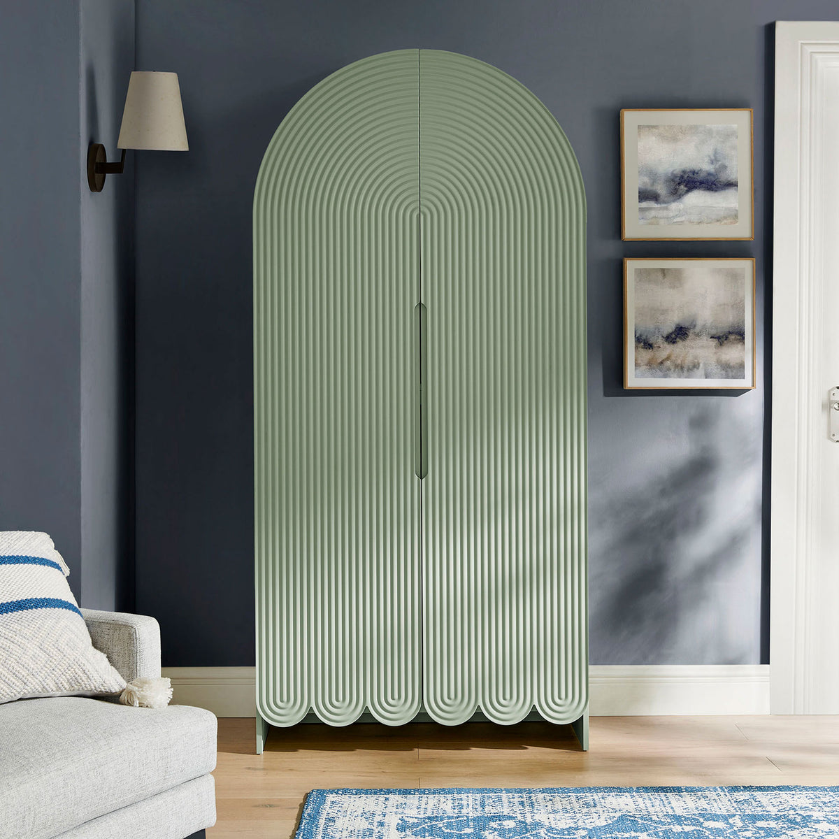 Sage green arched storage cabinet bringing sculptural fluted texture into the living room || EEI-7570-SGE || front_room