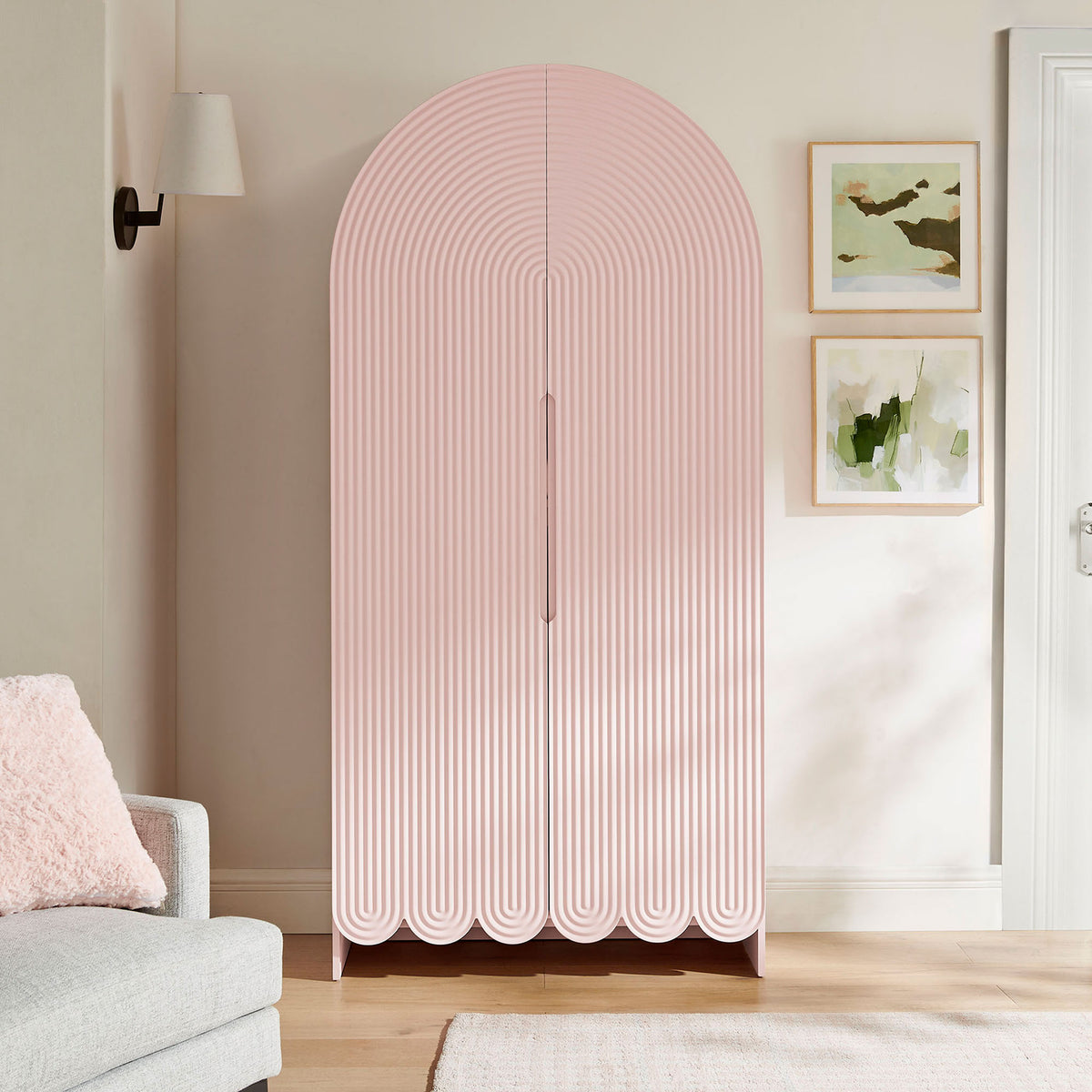 Soft pink arched storage cabinet adding playful sculptural texture to a bright living space || EEI-7570-SPN || front_room