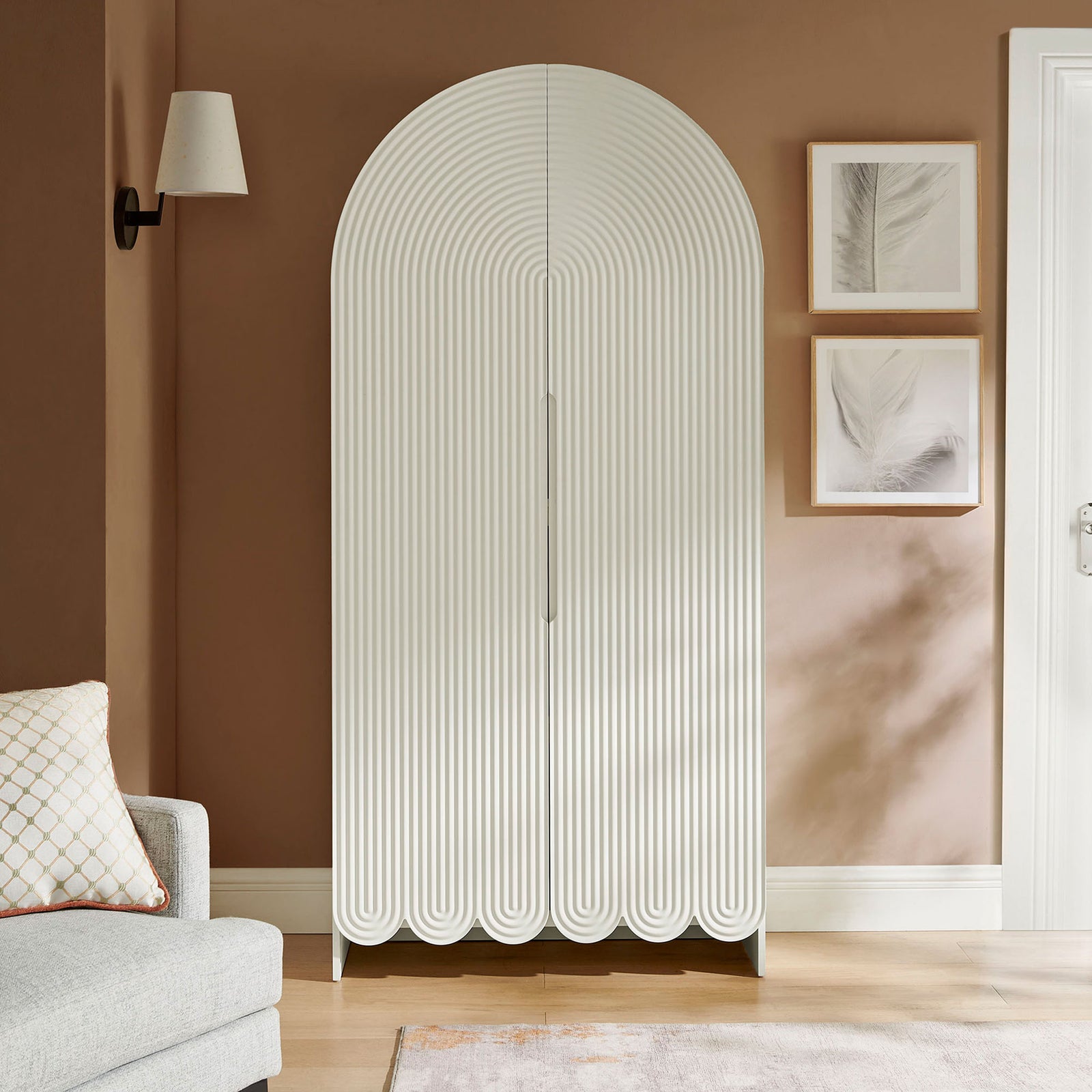 White arched storage cabinet bringing sculptural fluted texture to a warm living room || EEI-7570-WHI || front_room