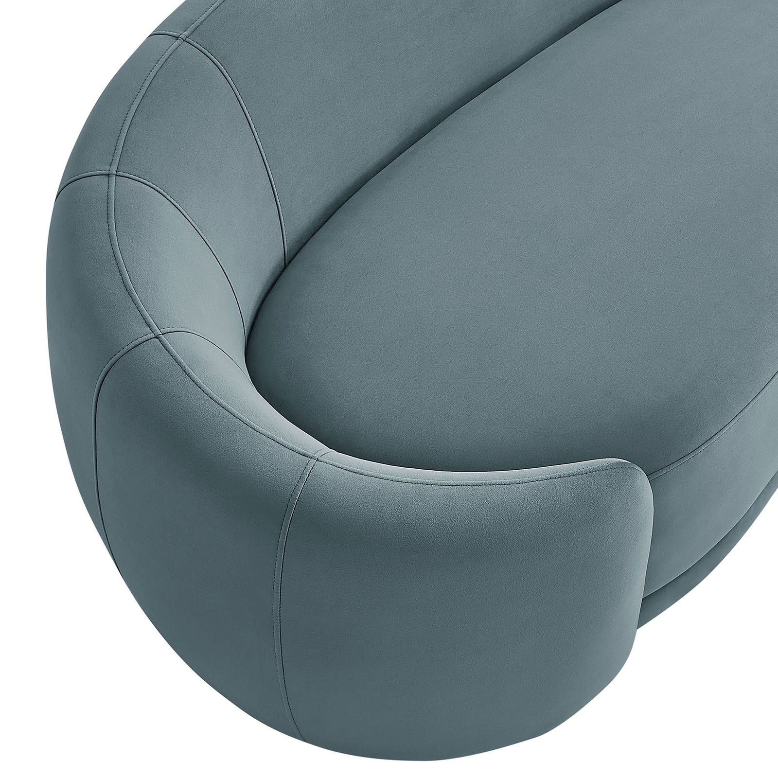 Top view of the sofa arm and seat showcasing the smooth curve and tailored seams in velvet. || EEI-7581-CAB || detail_studio