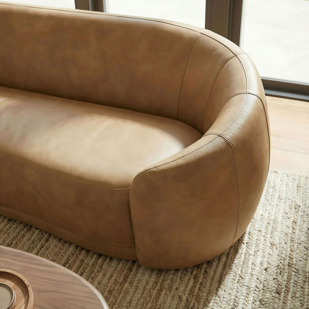 Curved armrest cradles the corner seat, pairing warm toast vegan leather with soft texture from the woven rug || EEI-7582-TST || detail_room