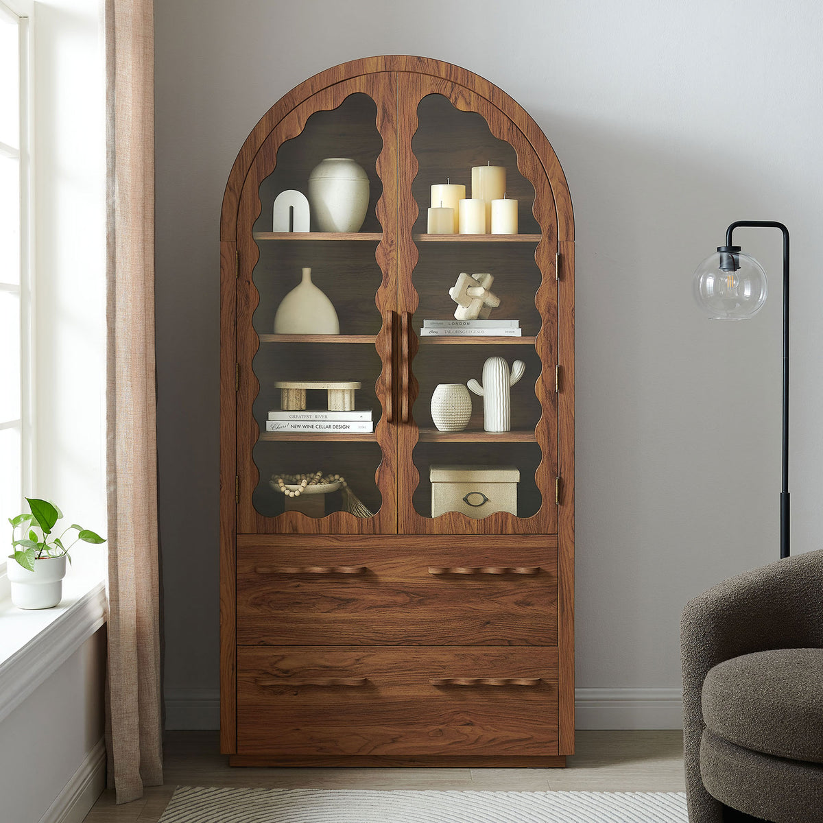 Walnut arched cabinet with scalloped glass doors and deep drawers in a modern living space || EEI-7589-WAL || front_room